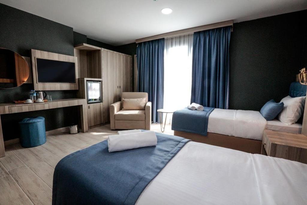 Двухместный (Двухместный номер с 1 кроватью (для 1 взрослого и 1 ребенка)) отеля CABA HOTEL &SPA, Измир