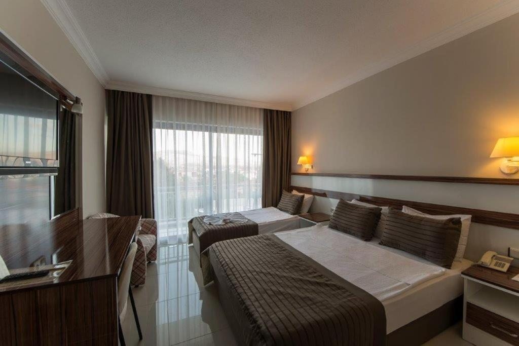 Двухместный (Двухместный номер Делюкс с 1 кроватью или 2 отдельными кроватями, вид на сад) отеля Le Monde Beach Resort & Spa, Измир