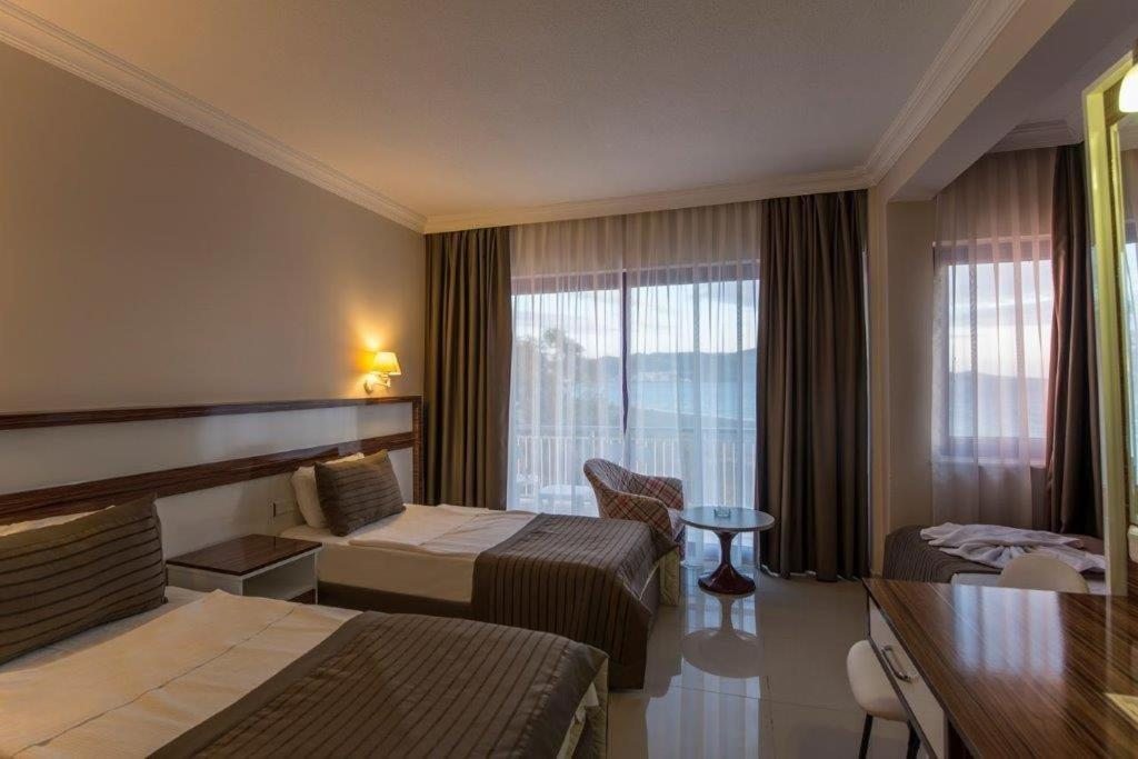 Двухместный (Двухместный номер Делюкс с 1 кроватью или 2 отдельными кроватями и видом на море) отеля Le Monde Beach Resort & Spa, Измир