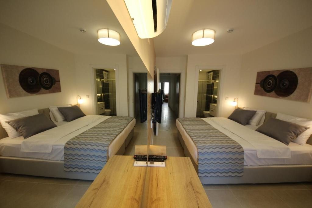 Двухместный (Стандартный двухместный номер с 1 кроватью или 2 отдельными кроватями) отеля SPİLOS GÜMÜLDÜR HOTEL, Измир