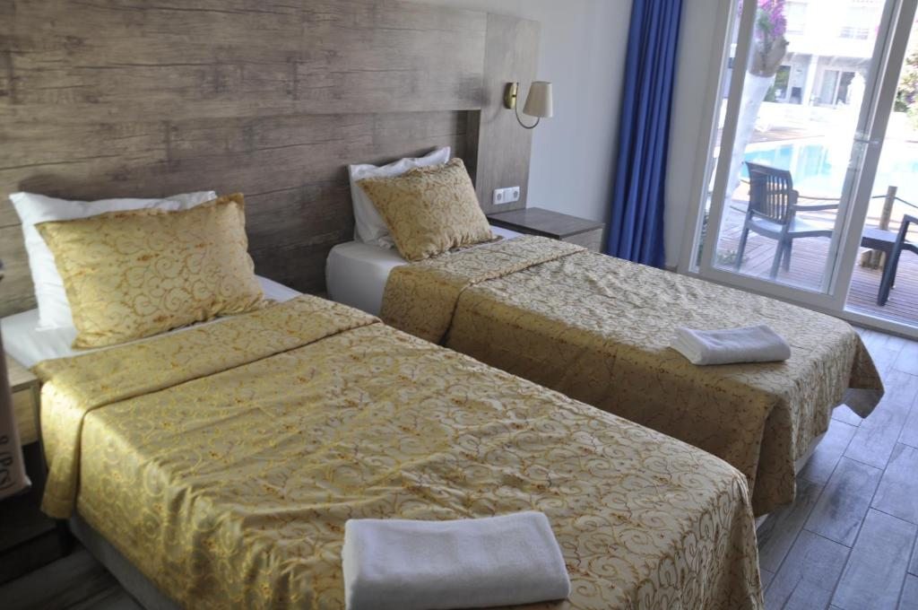 Двухместный (Двухместный номер эконом-класса с 1 кроватью или 2 отдельными кроватями) отеля Delfi Hotel Spa & Wellness Center, Бодрум