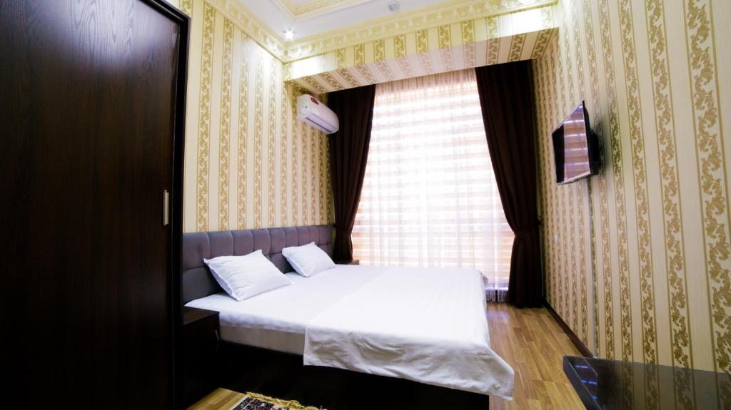 Двухместный (Двухместный номер с 2 отдельными кроватями и собственной ванной комнатой за пределами номера) отеля Alliance Hotel, Ташкент