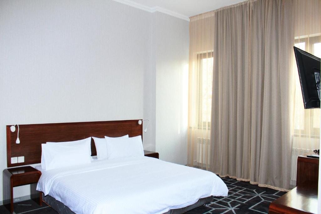 Двухместный (Улучшенный двухместный номер с 1 кроватью или 2 отдельными кроватями) отеля City Centre Hotel, Ташкент
