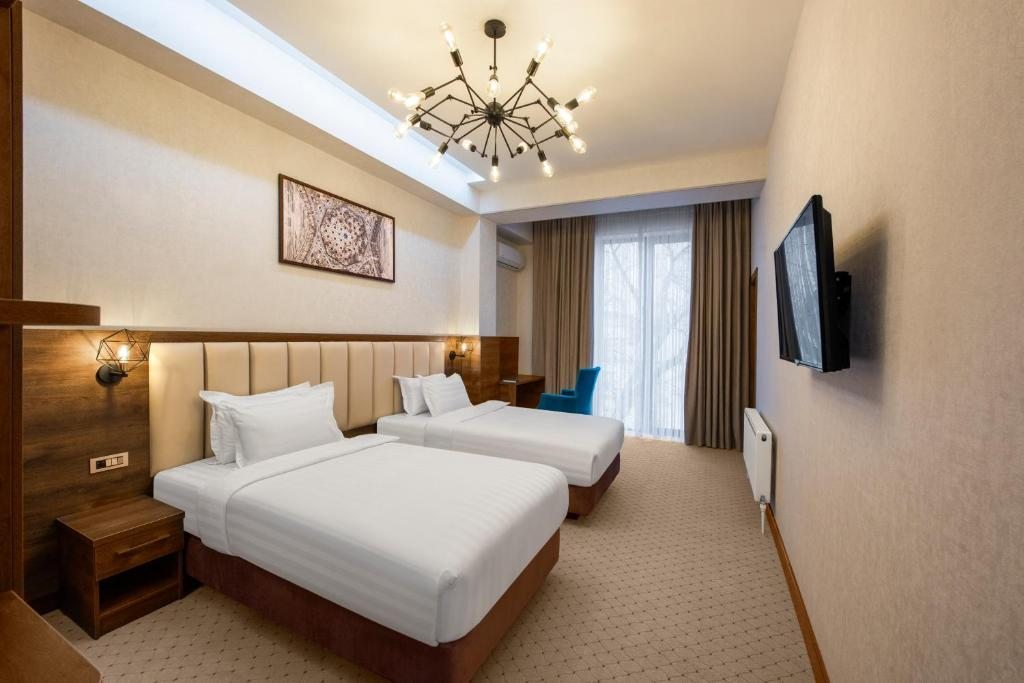 Двухместный (Улучшенный двухместный номер с 2 отдельными кроватями) отеля Corner Hotel Tashkent, Ташкент