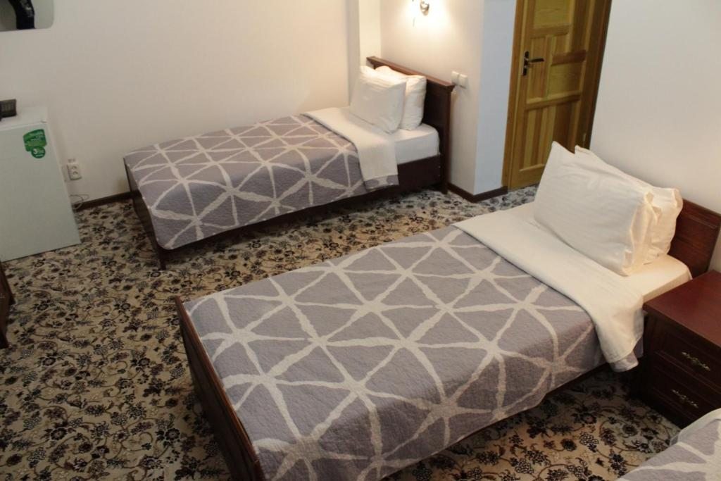 Двухместный (Двухместный номер с 2 отдельными кроватями и ванной) отеля Aist House, Бухара