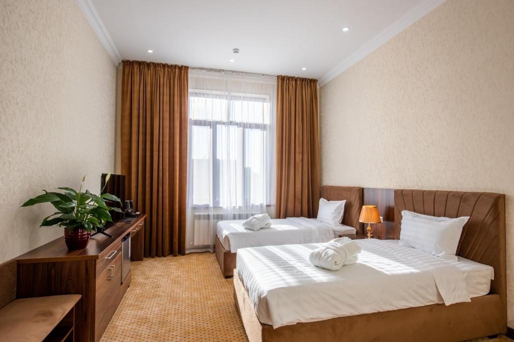 Двухместный (Двухместный номер с 2 отдельными кроватями и душем) отеля Fotima Sulton Hotel, Ташкент