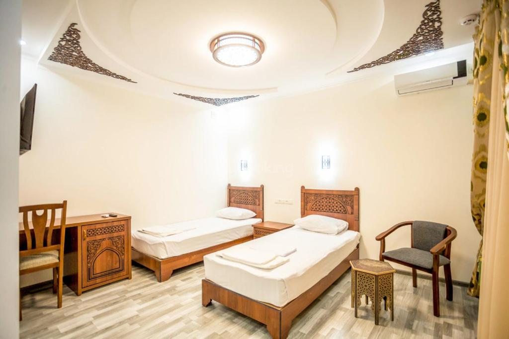 Двухместный (Двухместный номер с 1 кроватью или 2 отдельными кроватями и собственной ванной комнатой) отеля AYUB Boutique Hotel, Бухара