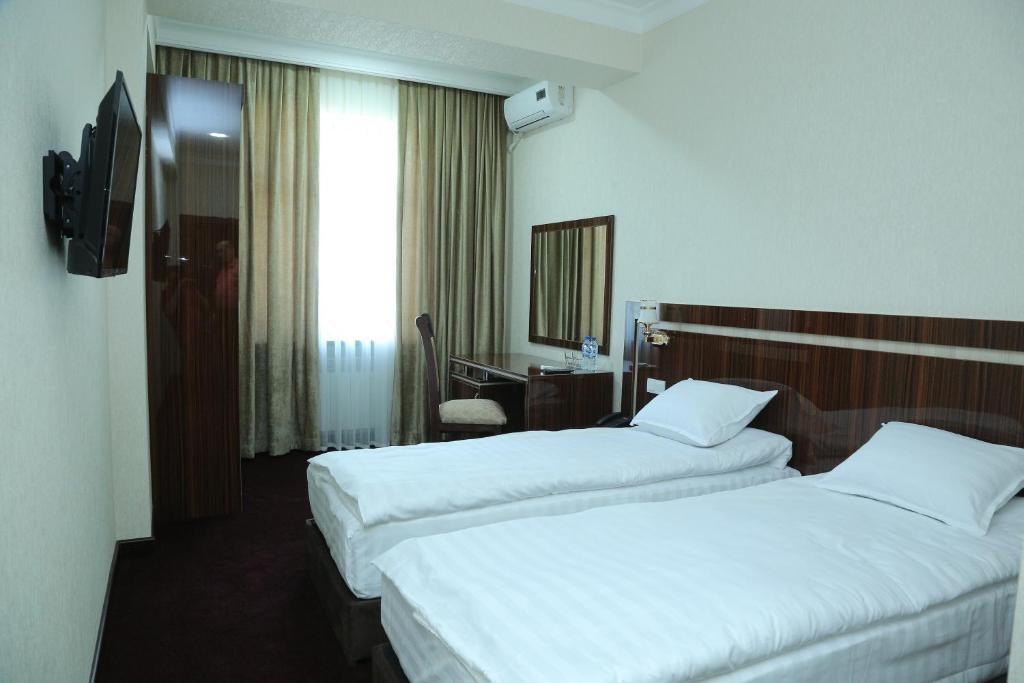 Двухместный (Двухместный номер Делюкс с 2 отдельными кроватями) отеля Hotel Grand Capital, Ташкент