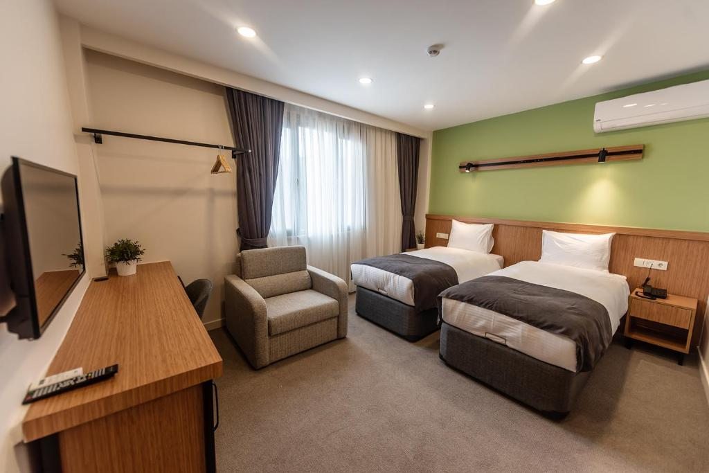 Двухместный (Улучшенный двухместный номер с 1 кроватью или 2 отдельными кроватями) отеля Bram Hotel Istanbul, Стамбул