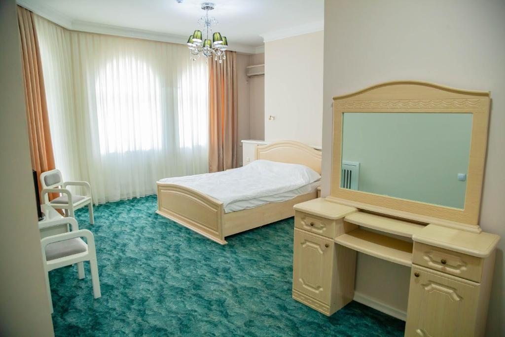 Двухместный (Двухместный номер Делюкс с 1 кроватью или 2 отдельными кроватями и балконом) отеля Ridon Lux Hotel, Ташкент