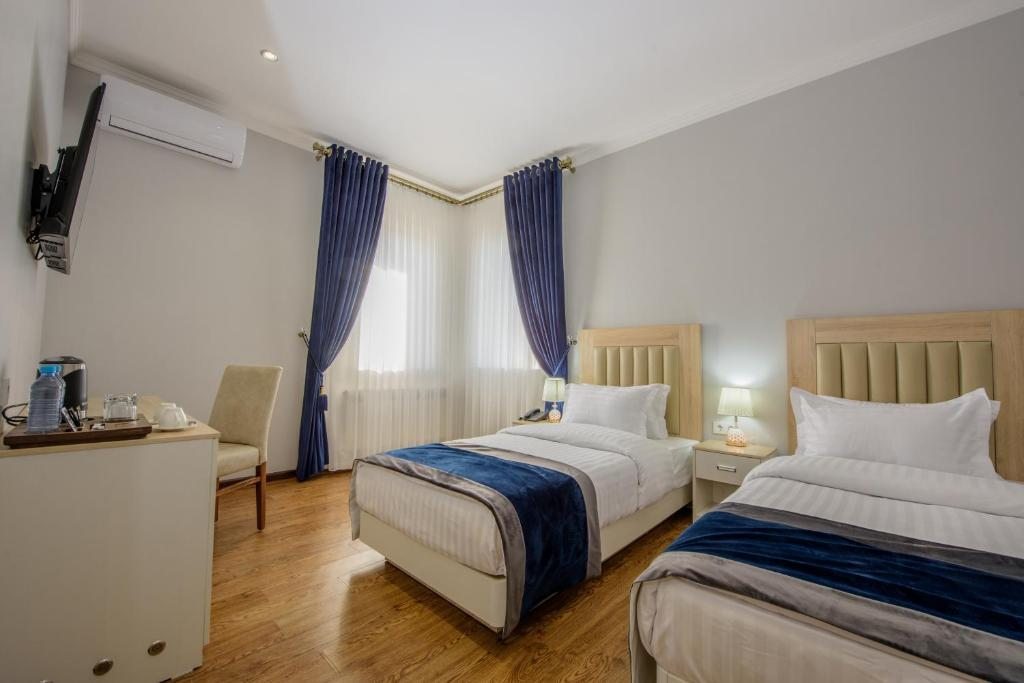 Двухместный (Двухместный номер Делюкс с 2 отдельными кроватями) отеля SATO HOTEL, Ташкент