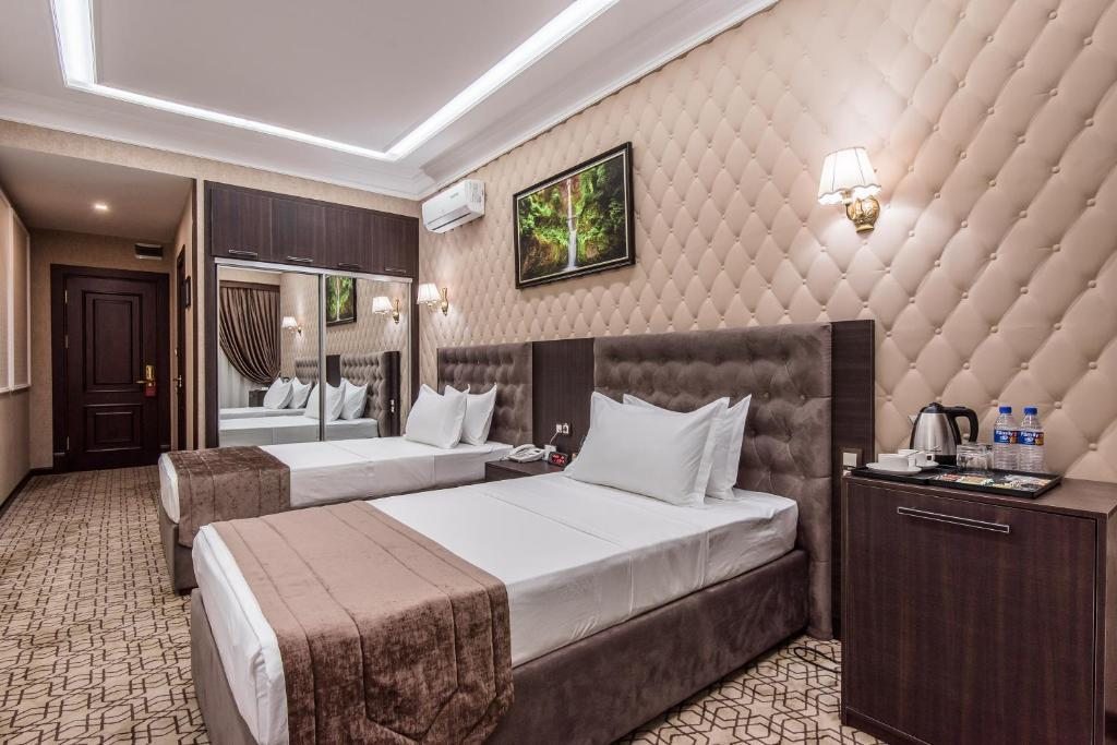 Двухместный (Стандартный двухместный номер с 2 отдельными кроватями) отеля The Royal Mezbon Hotel & SPA, Ташкент