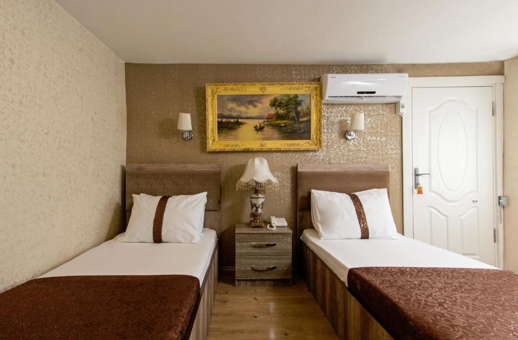 Двухместный (Стандартный двухместный номер с 2 отдельными кроватями) отеля carvan hotel, Стамбул