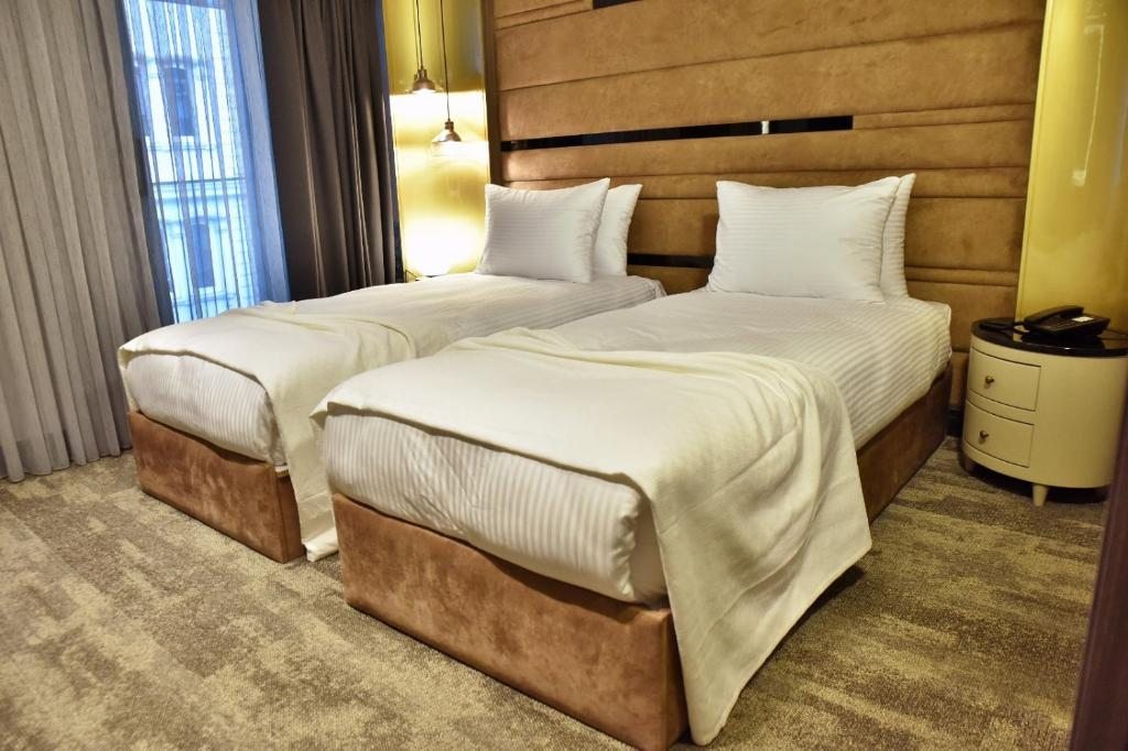 Двухместный (Стандартный двухместный номер с 2 отдельными кроватями) отеля Dosso Dossi Hotels Laleli, Стамбул