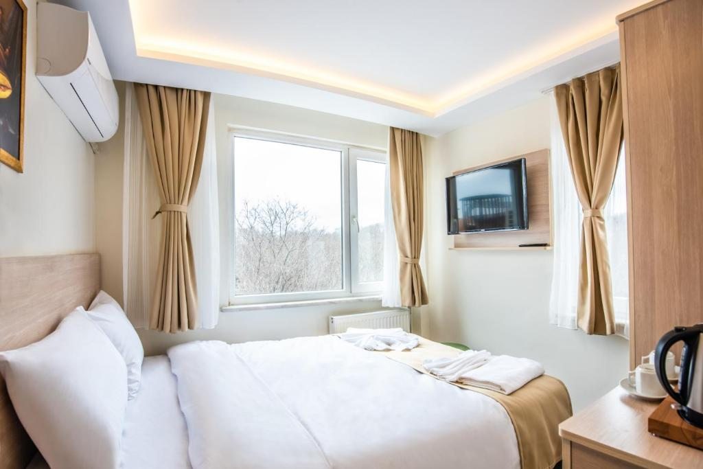 Двухместный (Стандартный двухместный номер с 1 кроватью или 2 отдельными кроватями) отеля Royal Bosphorus Hotel, Стамбул