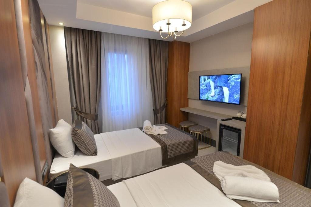 Двухместный (Стандартный двухместный номер с 2 отдельными кроватями) отеля Santra Hotel, Стамбул