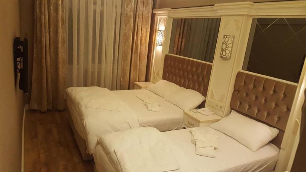 Семейный (Cемейный номер с собственной ванной комнатой) отеля Sun Comfort Hotel, Стамбул