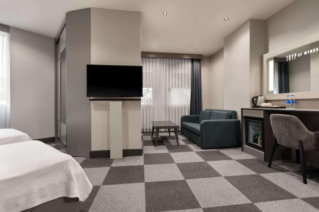 Трехместный (Номер Делюкс с 1 кроватью размера 