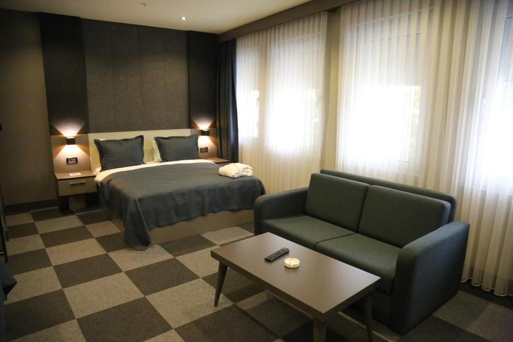 Трехместный (Номер Делюкс с 1 кроватью размера 