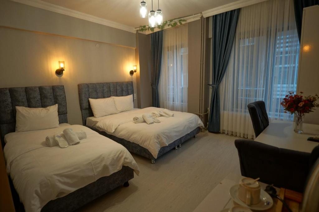 Трехместный (Стандартный трехместный номер) отеля Zion Home Butik Otel, Стамбул