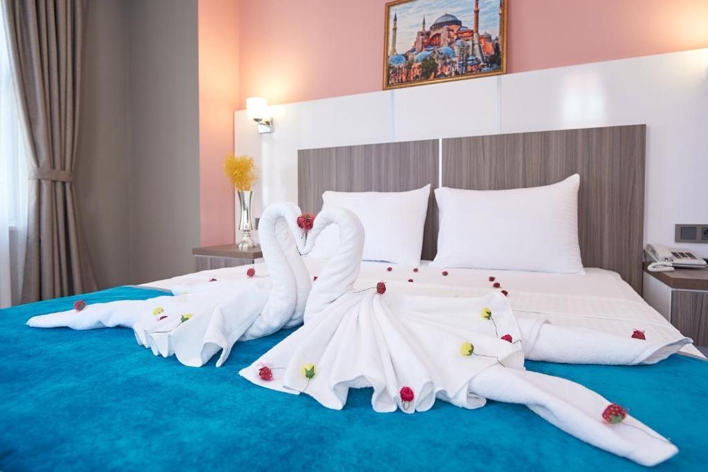 Двухместный (Улучшенный двухместный номер с 1 кроватью или 2 отдельными кроватями) отеля İstanbul Blue Hotel Beyazit, Стамбул