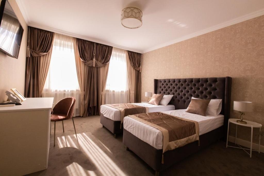 Двухместный (Двухместный номер с 2 отдельными кроватями) отеля Новый Рим, Краснодар