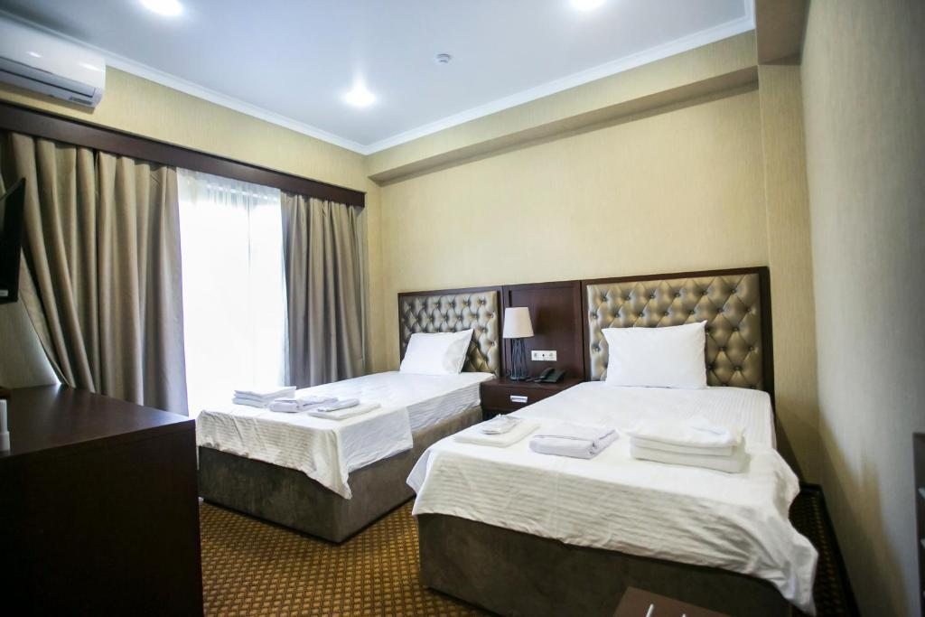 Двухместный (Двухместный номер с 2 отдельными кроватями и балконом) отеля AinLan, Сухум