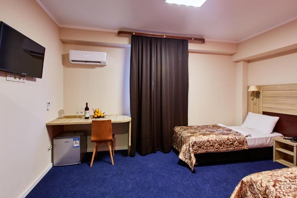 Двухместный (Улучшенный двухместный номер с 1 кроватью или 2 отдельными кроватями) отеля Hotel 