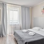 Двухспальная кровать в апартаментах Студио плюс