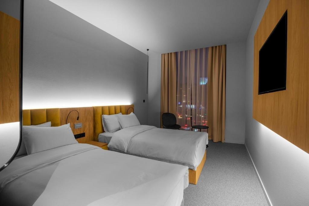 Двухместный (Двухместный номер с 2 отдельными кроватями - Подходит для гостей с ограниченными физическими возможностями) отеля Episode Tbilisi, Тбилиси