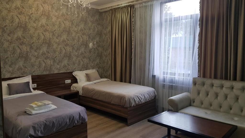 Двухместный (Улучшенный двухместный номер с 2 отдельными кроватями) отеля Nomad Hotel Bishkek Halal, Бишкек
