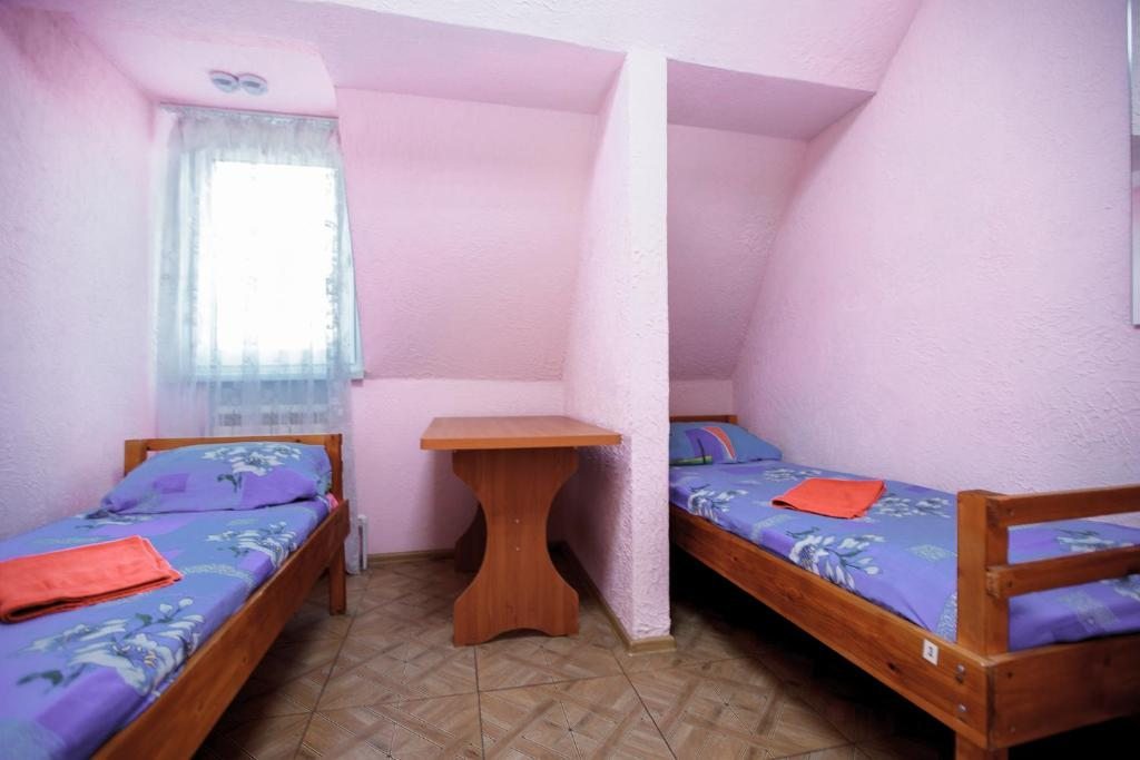 Номер (Односпальная кровать в общем номере для мужчин и женщин) хостела Агат, Омск