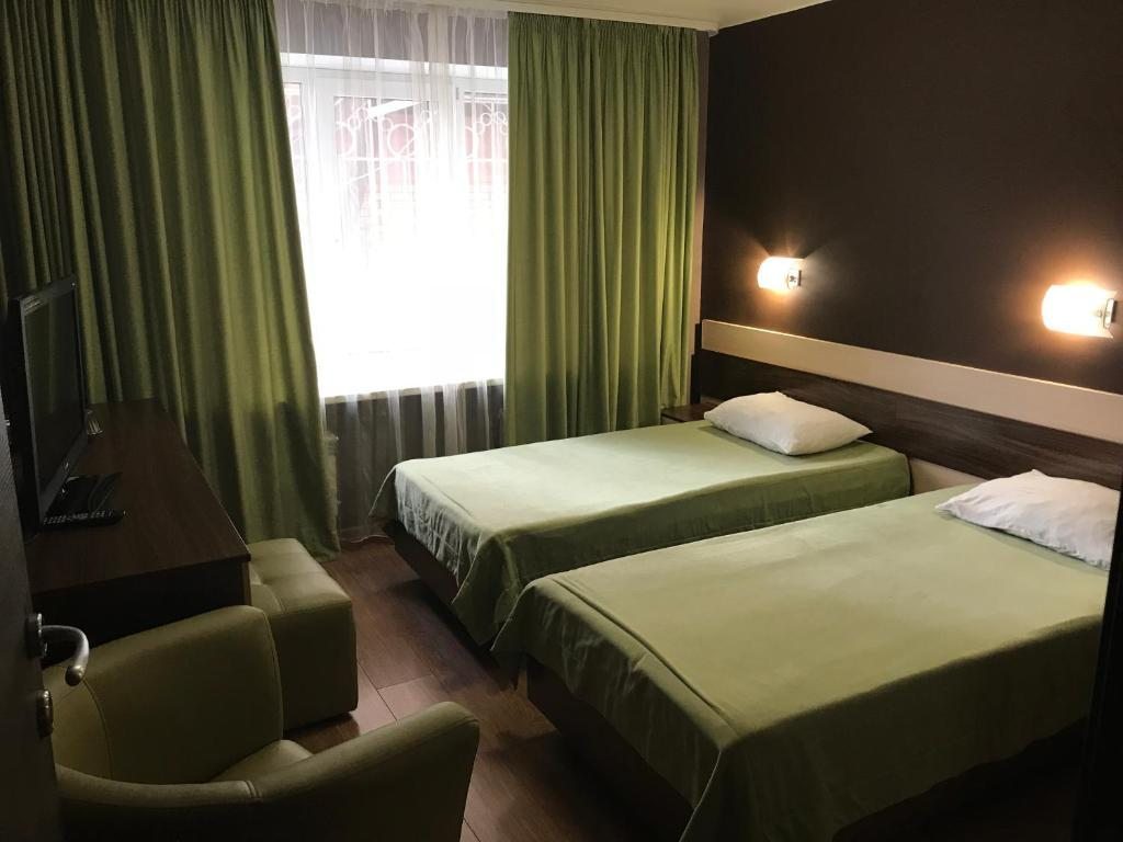 Двухместный (Стандартный двухместный номер с 2 отдельными кроватями) отеля Славянка-Копейск