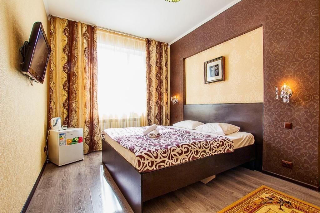Двухместный (Улучшенный двухместный номер с 1 кроватью или 2 отдельными кроватями) отеля Mini Hotel Bereket Dip, Астана