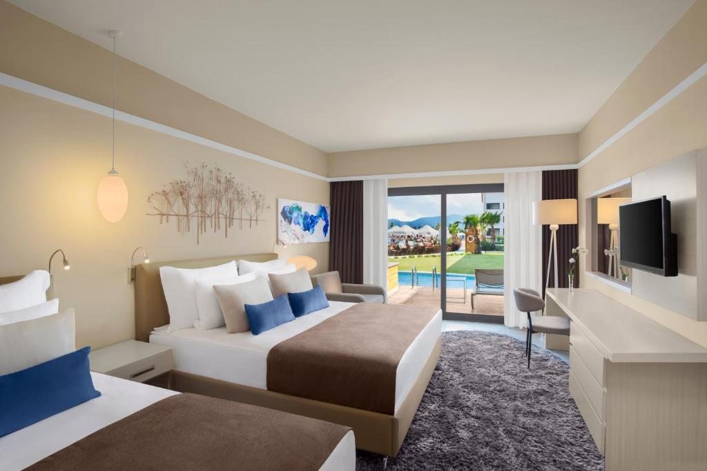 Двухместный (Двухместный номер с 1 кроватью и выходом к бассейну) отеля TUI SENSATORI Resort Barut Fethiye - Ultra All Inclusive, Фетхие