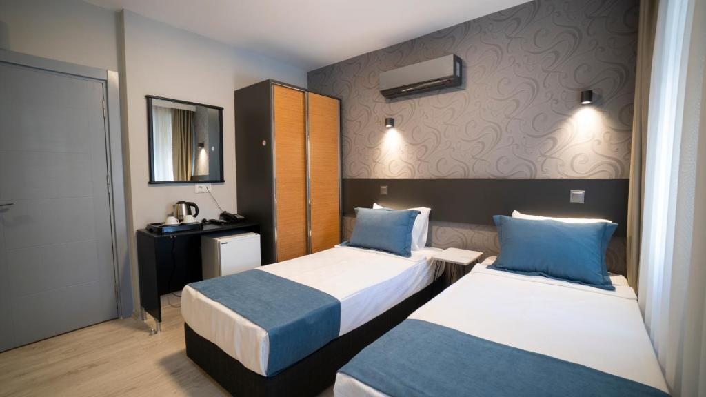 Двухместный (Двухместный номер Делюкс с 2 отдельными кроватями) отеля Mahper Hotel, Анталия