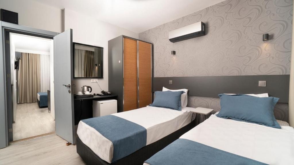 Двухместный (Улучшенный двухместный номер с 2 отдельными кроватями) отеля Mahper Hotel, Анталия