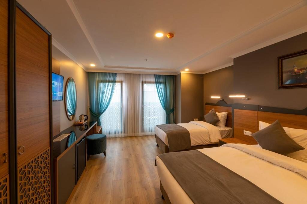 Двухместный (Двухместный номер Делюкс с 1 кроватью или 2 отдельными кроватями) отеля New Emin Hotel, Стамбул