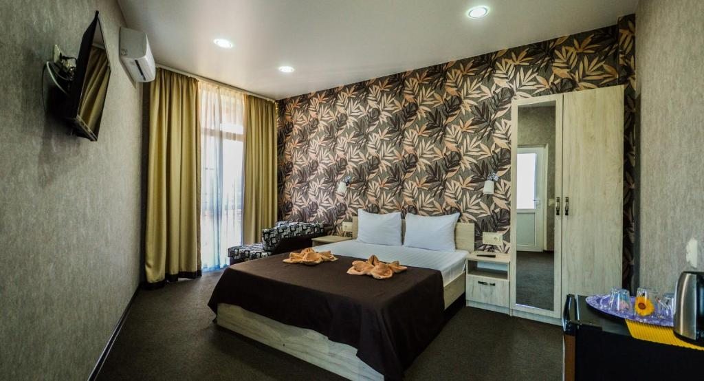 Двухместный (Двухместный номер Делюкс с 1 кроватью и дополнительной кроватью) отеля Summer House, Новомихайловский