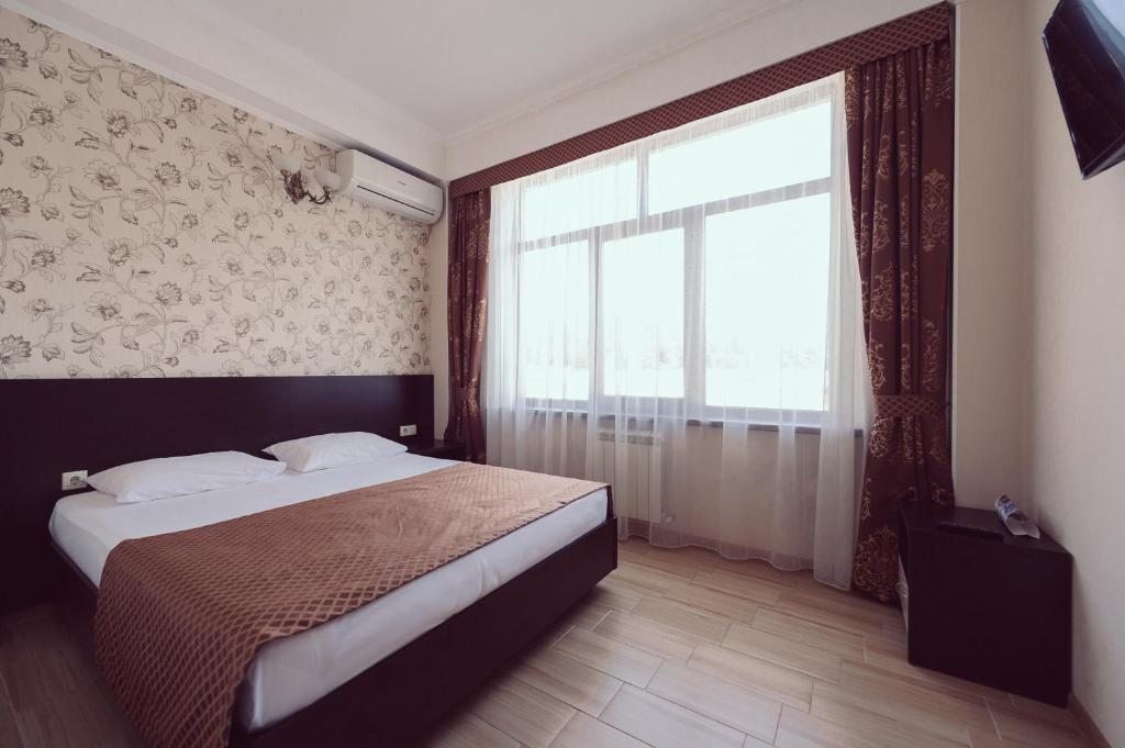 Двухместный (Стандартный двухместный номер с 1 кроватью или 2 отдельными кроватями) отеля Олимпия Лазаревское