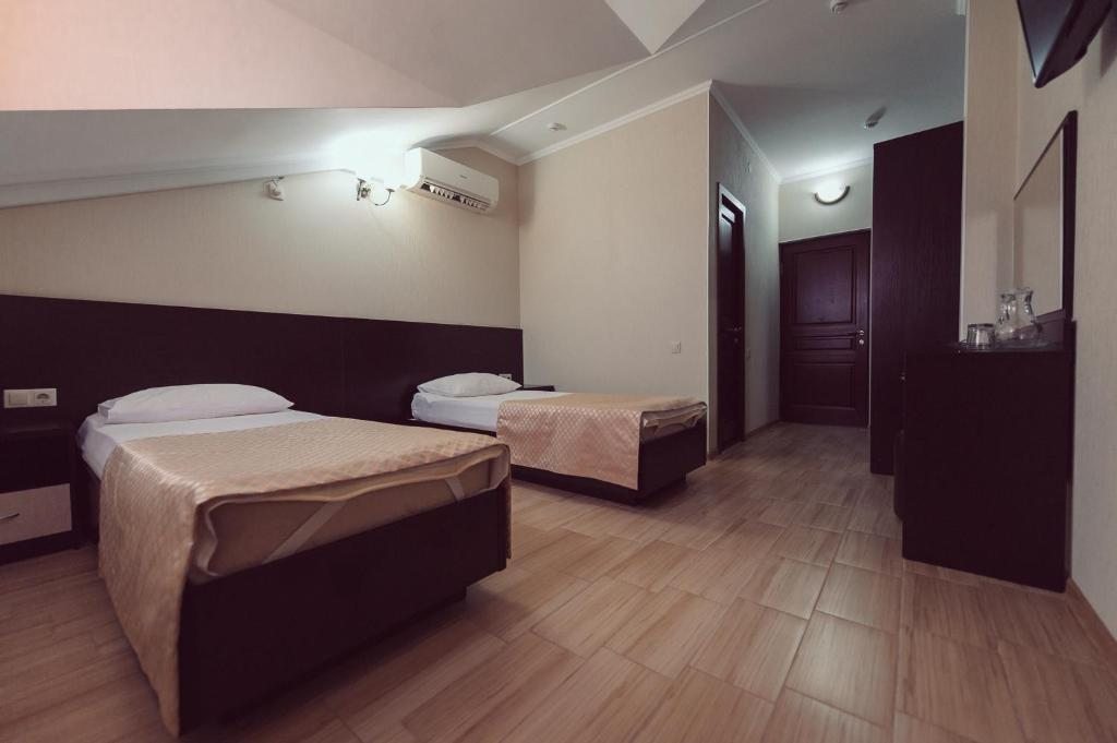 Двухместный (Двухместный номер «Комфорт» с 2 отдельными кроватями) отеля Олимпия Лазаревское