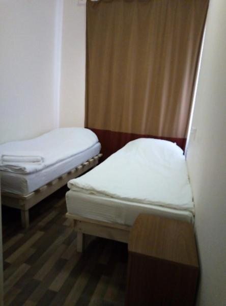 Двухместный (Двухместный номер с 2 отдельными кроватями и собственной ванной комнатой) отеля Bon Voyage, Санкт-Петербург
