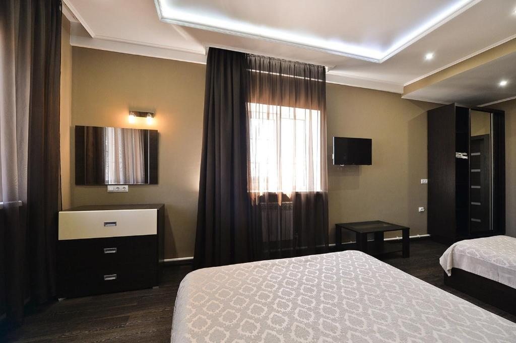 Двухместный (Двухместный номер Делюкс с 1 кроватью или 2 отдельными кроватями) отеля Infinity Hotel, Соль-Илецк