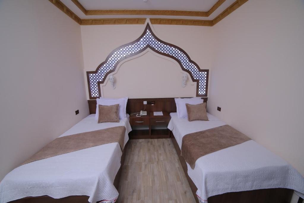 Двухместный (Двухместный номер с 1 кроватью или 2 отдельными кроватями и собственной ванной комнатой) отеля Minor Boutique Hotel, Хива