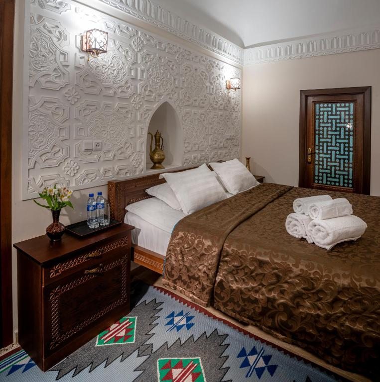 Двухместный (Двухместный номер с 1 кроватью и собственной ванной комнатой) отеля New star khiva hotel - Madrasah Muhammad Mahram, Хива