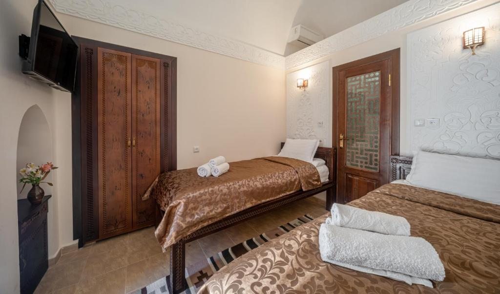Двухместный (Двухместный номер с 2 отдельными кроватями) отеля New star khiva hotel - Madrasah Muhammad Mahram, Хива
