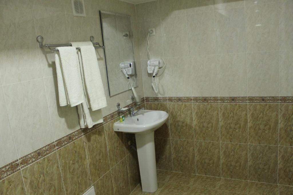Одноместный (Стандартный одноместный номер с душем) отеля Tashkent Hotel, Нукус