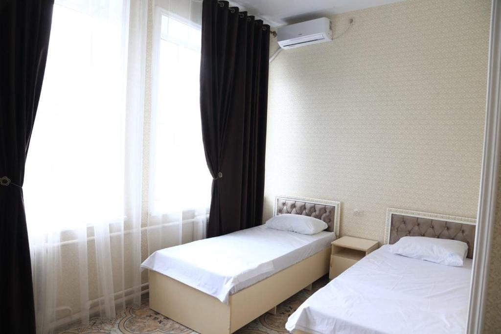 Двухместный (Двухместный номер с 2 отдельными кроватями и ванной комнатой) отеля GRAND HOTEL, Дербент