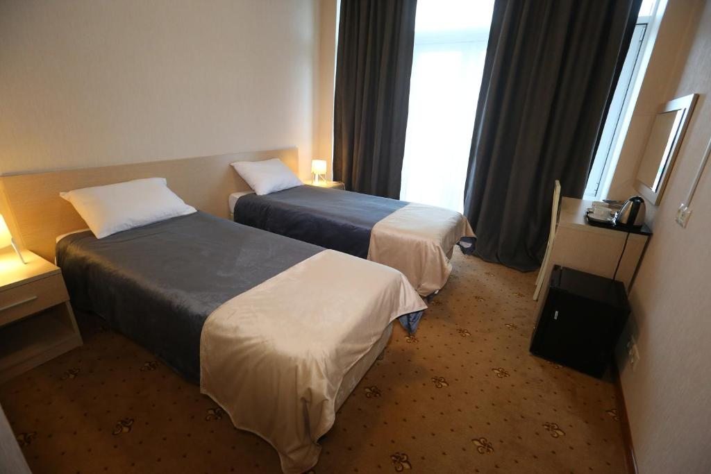 Двухместный (Стандартный двухместный номер с 2 отдельными кроватями) отеля РУС, Гудермес