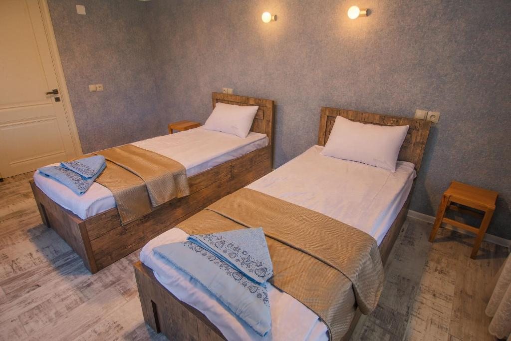 Двухместный (Стандартный двухместный номер с 2 отдельными кроватями и общей ванной комнатой) гостевого дома Luca Lili, Сигнахи